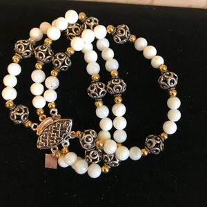 Silver, gold, and white bead bracelet